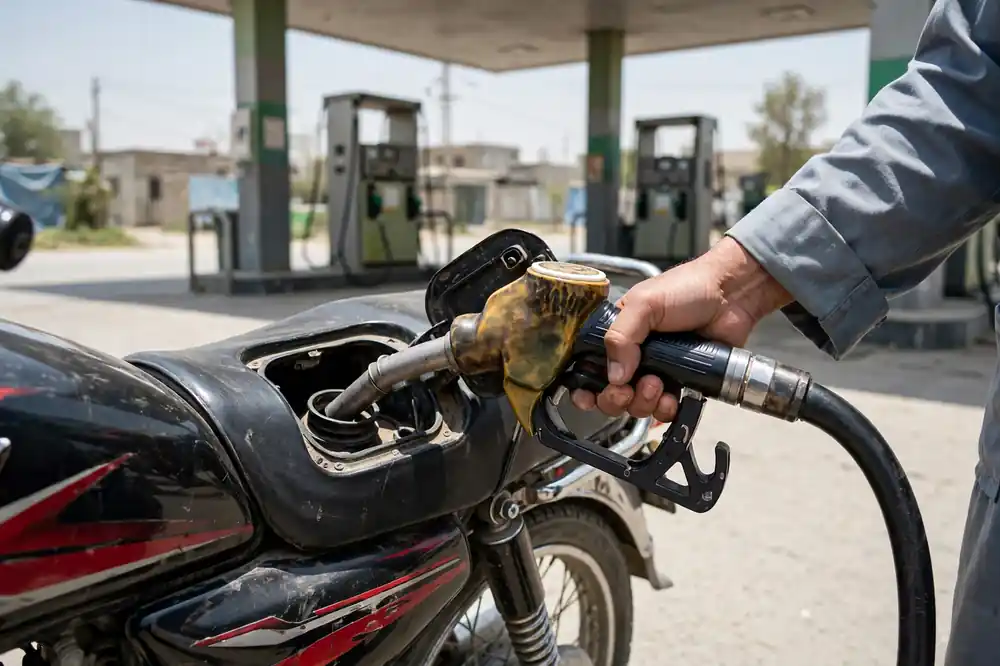 Petrol subsidy Sindh — motorcycle being refueled at a petrol pump in Pakistan